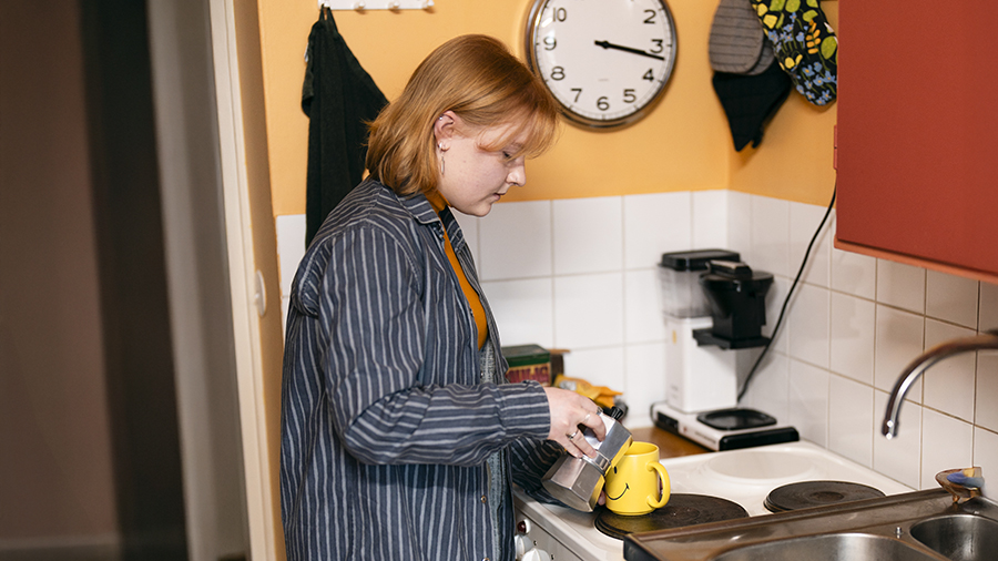 Young person in the kitchen.